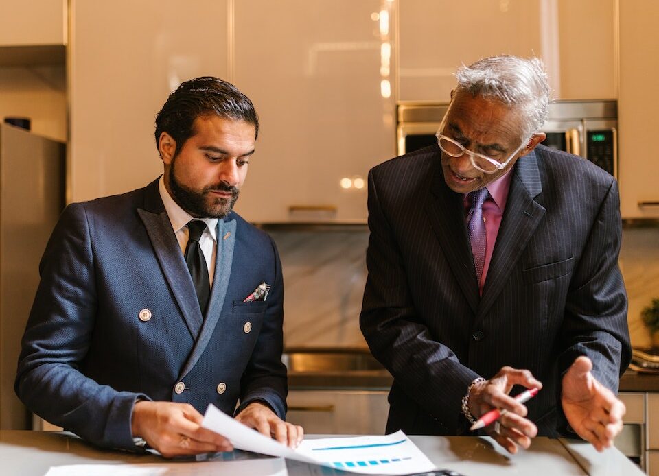 An wrongful death attorney explaining a document to a colleague